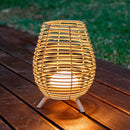 Bossa 30 Rechargeable Rattan Lamp outside on Decking