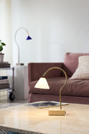 Modern table lamp on a coffee table in a living room setting