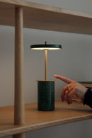 Umage Asteria Move Mini Portable Table Lamp in Green Marble on a shelf