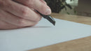 Video of someone scetching the Acorn Lampshade by Umage followed by  the real acorn lampshade being shown on a wall fitting