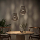 A pair of Pilke Wooden Pendant lights in White Birch hung above a small dining table and chairs.