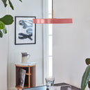 Umage Asteria Pendant Light in Rose above a coffee table