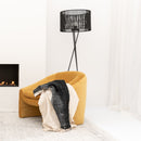 Original Home Drum Rattan Lampshade on a floor lamp behind a chair