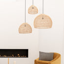 Original Home Globe Rattan Lampshade Natural hung in group of 3 above a chair next to a fire in a modern neutral coloured room