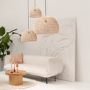 Original Home Globe Rattan Lampshade Natural hung in a collection of 3 over a cream sofa and coffee table.