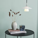 Halo Design Scandinavia Opal Glass Pendant Light handing over side table