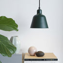 Halo Design Carpenter Metal Pendant Light in green over a table