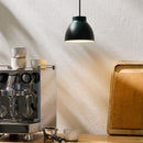 Halo Design Object Pendant Light in green next to coffee machine in kitchen space