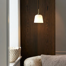 Halo Design Room 49 Pendant Light handing over cosy chair