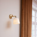 Halo Design Room 49 Wall Light n wall next to curtains