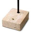Beige stone base with a black rod and gold accent on a white background