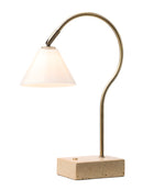 Table lamp with curved arm and concrete base on a white background