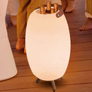 Outdoor light fixture with drink holders on a wooden deck