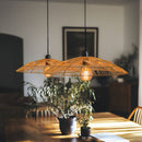 Thatch Dome Rattan Lampshade hung in a pair above a dining table