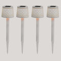 Four solar-powered garden lights with lattice designs on a white background