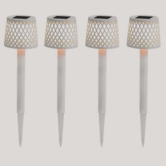 Four solar-powered garden lights with lattice designs on a white background