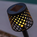  Gretita Solar Light Garden Spike Close up of a Solar-powered outdoor light with grid design on a blurred background 