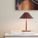 Rechargeable Halo Hygge Table Lamp by Halo Lighting on a magazine on sideboard