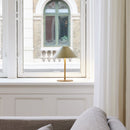 Rechargeable Halo Hygge Table Lamp by a window 