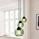 Halo Design Bubbles glass pendant lights in green, close-up of three sizes — 14cm, 18cm and 24cm sphere glass pendants
