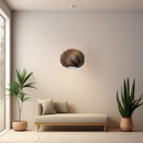 Nuez Laminate Wooden  Lampshade above a Chaise Long with Plants on either side