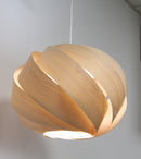 Nuez Laminate Wooden Lampshade in Light Oak on a pendant light fitting