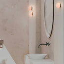 Robin Lamps Rock Wall Light in Black and Alabaster mounted in modern bathroom