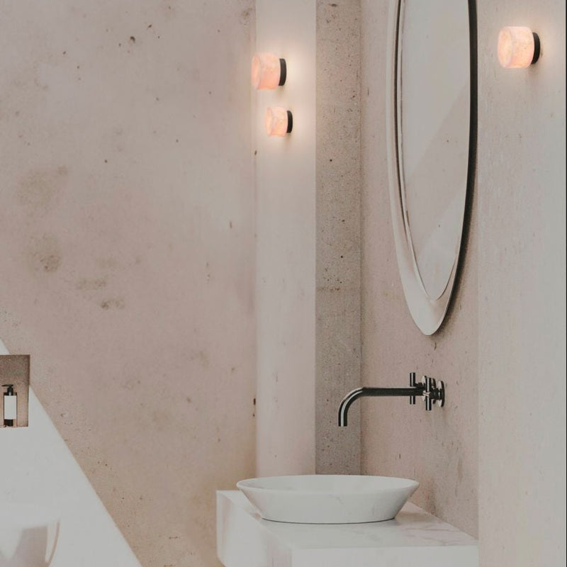 Robin Lamps Rock Wall Light in Black and Alabaster mounted in modern bathroom