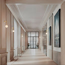 Robin Lamps Royal Single Arm Wall Light in Brass and Alabaster mounted in bright office hallway