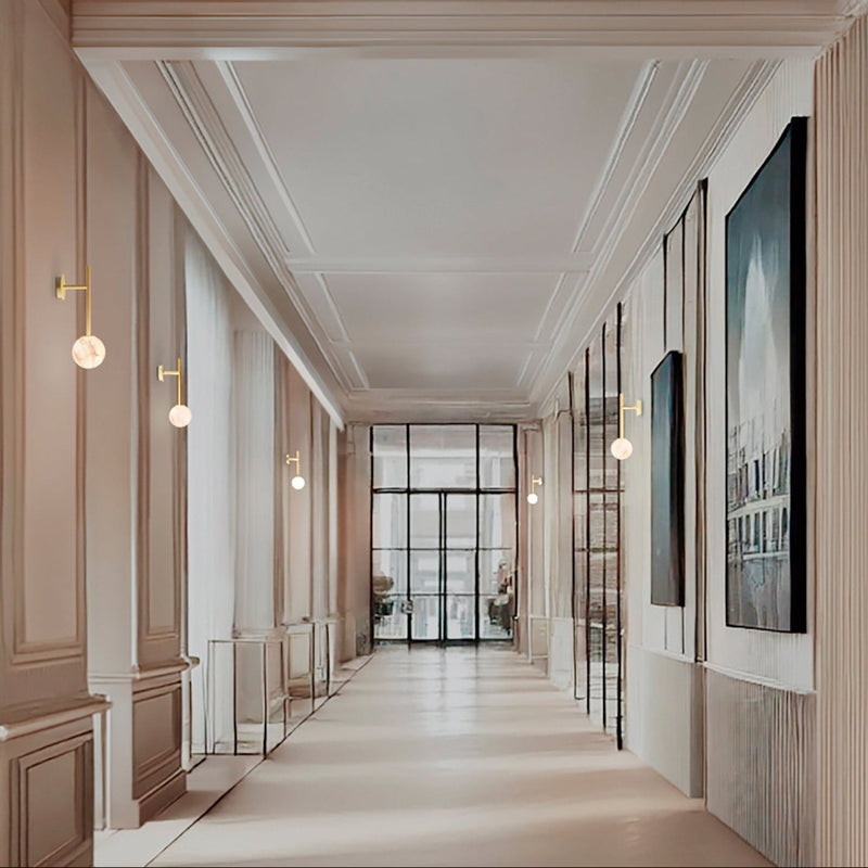 Robin Lamps Royal Single Arm Wall Light in Brass and Alabaster mounted in bright office hallway