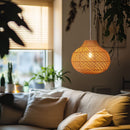 Thatch Jar Lampshade hung low over a sofa