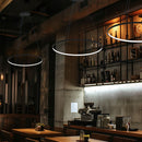 Vortex LED Ring Pendant Lights in a row in a restaurant providing mood lighting