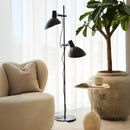 Halo Design Metropole 2-Arm Floor Lamp in Black in living room