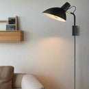 Halo Design Metropole Wall Light in Black on wall in living room
