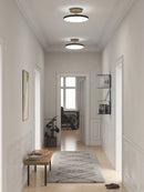Pair of Umage Asteria Up ceiling lights in a Hallway with down and up lighting