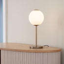 Umage Audrey Spherical Glass Table Lamp on a side table