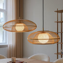 A pair of Umage Faraday Pendant Lampshades above a table and chairs