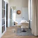 A Modern Room with a table and Chairs, a Floor legth mirror and a Clava Wall Light by Umage