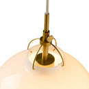 Close-up detail of Halo Design Toscana pendant light antique brass cap and curved arm fitting mounted on hand-blown glass sphere