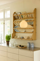 Halo Design Toscana glass pendant light in opal large 36cm styled in a Scandinavian kitchen beside a rustic wooden plate rack