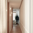 Robin Lamps Rock Alabaster Wall Ceiling Light lining a warm hallway corridor