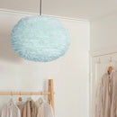 XLarge light blue Umage pendant lampshade hanging in a sleek modern closet