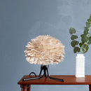 light brown micro Umage table lampshade sitting on a brown wood table