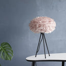 light rose Umage table lampshade sitting on a coffee table