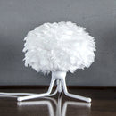 white Umage table lampshades sitting on a brown wood table