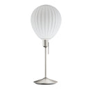 Around the world table lamp by Umage, inspired by the shapes of hot air balloons. A white glass lampshade and elegant Santé table base in Steel