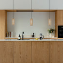 3 Umage Komorebi Wooden Lampshades over a kitchen island