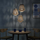 Collection of 3 Natural Birch Pilke Wooden Pendant Lights over a small dining table and chairs