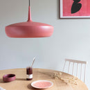 Earth Red Clava Dine Lampshade by Umage over a dining table and chair