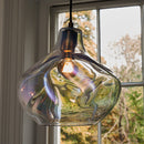 Parison Glass Pendant Light in front of a window
